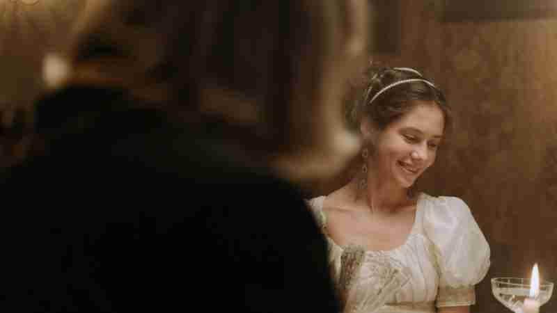 A smiling woman in a vintage white dress enjoys a candlelit dinner with an elegant ambiance., tags: il - pexel